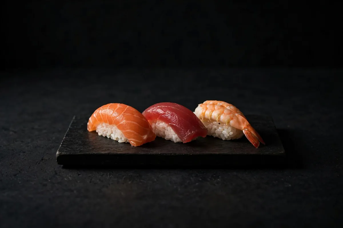 Three nigiri on a slate